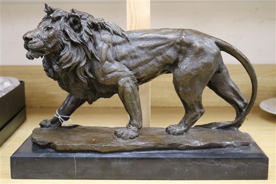 A bronze of a standing lion, on marble base height 29cm